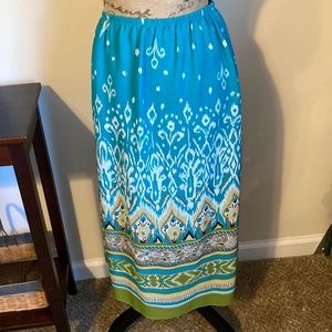 Skirt fully lined. Adjustable waist.